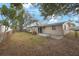 This home features a spacious backyard with a patio, perfect for entertaining and outdoor living at 5317 Tammy Ln, Holiday, FL 34690