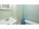 Bathroom featuring a vanity and toilet, providing a simple design at 5317 Tammy Ln, Holiday, FL 34690