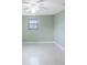 This empty bedroom offers a large window and a ceiling fan at 5317 Tammy Ln, Holiday, FL 34690