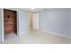 Bedroom with a spacious closet with wood backing and Terrazzo flooring, offering ample storage at 5317 Tammy Ln, Holiday, FL 34690