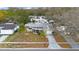 Charming single-story home with a screened porch, well-maintained lawn, and mature landscaping at 5317 Tammy Ln, Holiday, FL 34690