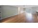 Laminate floored living room open to kitchen and screened porch at 5317 Tammy Ln, Holiday, FL 34690