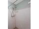 A close-up view of a shower with white tile at 5317 Tammy Ln, Holiday, FL 34690
