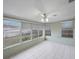 The sunroom is enclosed with multiple windows providing natural light and tile floors at 5317 Tammy Ln, Holiday, FL 34690