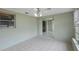 An enclosed sun room offers tile floors and natural lighting from multiple windows at 5317 Tammy Ln, Holiday, FL 34690