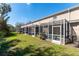 Multiple screened patios extending along the back of the home, enhancing outdoor living and entertainment options at 5712 Fishhawk Ridge Dr, Lithia, FL 33547