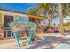 Charming exterior view of the Upham Beach Paradise Grille with a stone base and colorful signage at 6800 Sunset Way # 1003, St Pete Beach, FL 33706