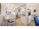 Bright kitchen and dining area featuring stainless steel appliances and granite countertops at 6800 Sunset Way # 1003, St Pete Beach, FL 33706