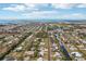 Expansive aerial view showcasing a neighborhood with waterfront access and beautiful coastal scenery in the distance at 829 E 4Th St, Englewood, FL 34223