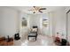 Bright bedroom with comfortable seating, plenty of natural light, and ceiling fan at 829 E 4Th St, Englewood, FL 34223