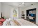 Cozy bedroom with desk and office space, natural light, and ceiling fan at 829 E 4Th St, Englewood, FL 34223