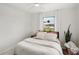 Bedroom featuring neutral tones, natural light, and a ceiling fan at 829 E 4Th St, Englewood, FL 34223