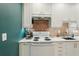 Updated kitchen with bright white cabinets, a modern backsplash, and an electric range at 829 E 4Th St, Englewood, FL 34223