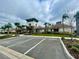 Community clubhouse featuring covered parking and professional landscaping for a welcoming appearance at 8438 Wheat Stone Dr, Zephyrhills, FL 33540