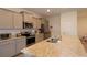 Modern kitchen featuring granite countertops, stainless steel appliances, and ample cabinet space at 8438 Wheat Stone Dr, Zephyrhills, FL 33540