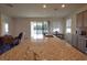 Open concept kitchen island with granite counters at 8438 Wheat Stone Dr, Zephyrhills, FL 33540