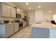 Stylish kitchen with stainless steel appliances and granite countertops at 8438 Wheat Stone Dr, Zephyrhills, FL 33540