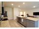 Well-equipped kitchen with a large island, stainless steel appliances, and plenty of storage space at 8438 Wheat Stone Dr, Zephyrhills, FL 33540