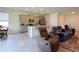 Open floor plan featuring living room and kitchen with bar seating at 8438 Wheat Stone Dr, Zephyrhills, FL 33540
