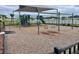 Community playground featuring swings, slides, and climbing structures with safety-first wood chip ground cover at 8438 Wheat Stone Dr, Zephyrhills, FL 33540