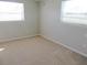 Bedroom with neutral walls, light colored carpet, and a bright airy feel at 9062 Sunrise Dr, Largo, FL 33773