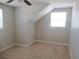 Cozy bedroom features light-colored carpet, neutral walls, and windows for natural light at 9062 Sunrise Dr, Largo, FL 33773