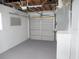 Spacious garage featuring an automatic door opener and plenty of storage at 9062 Sunrise Dr, Largo, FL 33773