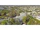 Aerial view of townhomes surrounded by lush green trees and well-maintained landscaping at 9770 Indian Key Trl # 102, Seminole, FL 33776