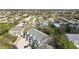 An aerial view of townhomes surrounded by lush trees, nestled in a quiet neighborhood at 9770 Indian Key Trl # 102, Seminole, FL 33776