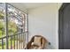 Cozy balcony featuring a comfortable wicker chair and scenic views at 9770 Indian Key Trl # 102, Seminole, FL 33776