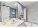 Bathroom with a shower-tub combo, light blue wall paint and bright light at 9770 Indian Key Trl # 102, Seminole, FL 33776