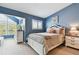 Bright blue bedroom featuring bright natural light and clean modern decor at 9770 Indian Key Trl # 102, Seminole, FL 33776