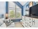 Window nook featuring natural light, a dresser, and a striped sofa at 9770 Indian Key Trl # 102, Seminole, FL 33776