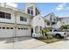 Attractive townhome with a manicured lawn and convenient garage parking at 9770 Indian Key Trl # 102, Seminole, FL 33776