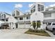 Charming townhome featuring a well-maintained front yard and attached garage at 9770 Indian Key Trl # 102, Seminole, FL 33776