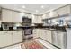 Well-equipped kitchen with stainless steel appliances and ample counter space at 9770 Indian Key Trl # 102, Seminole, FL 33776