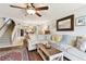 Open living room with large sectional sofa, view into the kitchen and dining area at 9770 Indian Key Trl # 102, Seminole, FL 33776