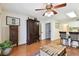 Comfortable living room with wood-look tile and antique furniture at 9770 Indian Key Trl # 102, Seminole, FL 33776