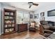 Home office with hardwood floors, built-in bookshelf, and plenty of natural light at 9770 Indian Key Trl # 102, Seminole, FL 33776