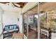 Enclosed patio features comfortable seating and sliding glass doors for indoor-outdoor living at 9770 Indian Key Trl # 102, Seminole, FL 33776