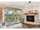 Screened-in porch with wood table and chairs, and views of the lush, green landscape at 9770 Indian Key Trl # 102, Seminole, FL 33776