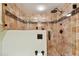 Modern shower with tile surround and rainfall shower head at 9770 Indian Key Trl # 102, Seminole, FL 33776