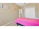 A bedroom with pink accents and a closet at 1041 Andrew Aviles Cir, Tampa, FL 33619