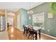 Charming dining area with a chandelier and ample natural light at 1041 Andrew Aviles Cir, Tampa, FL 33619