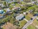 Birds-eye view of the home on a canal, showing the roof and driveway at 106 W North Branch Rd, Ruskin, FL 33570