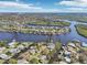 Breathtaking aerial view of the neighborhood, highlighting its canal-front homes, waterways, and scenic surroundings at 106 W North Branch Rd, Ruskin, FL 33570