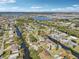Great aerial view of homes lining a canal under a bright blue sky and lake views in distance at 106 W North Branch Rd, Ruskin, FL 33570