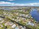 Beautiful aerial view of homes lining canal under a bright blue sky with scattered clouds at 106 W North Branch Rd, Ruskin, FL 33570