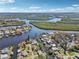 Scenic aerial view of the community, surrounded by tranquil waterways, lush vegetation, and serene atmosphere at 106 W North Branch Rd, Ruskin, FL 33570