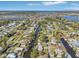 Beautiful aerial view of homes lining a canal under a bright blue sky and lake views in distance at 106 W North Branch Rd, Ruskin, FL 33570